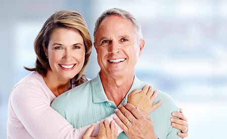 dental implants in colorado springs - smiling older couple